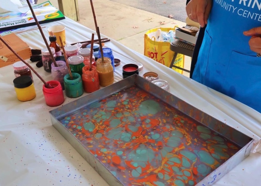 Paints and a marbling tray at a Wellspring ebru art workshop